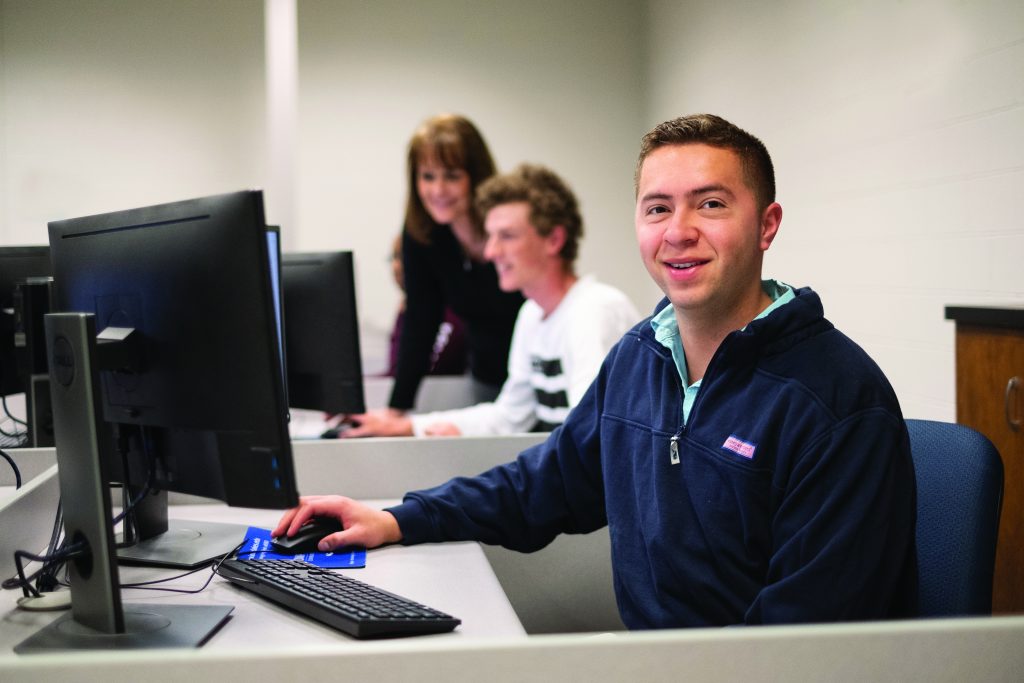 Accounting Specialist student at computer