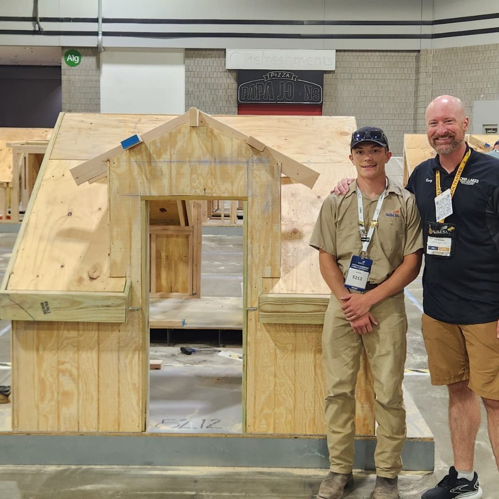 Tate Myers & Corey Menning in front of his finish project.