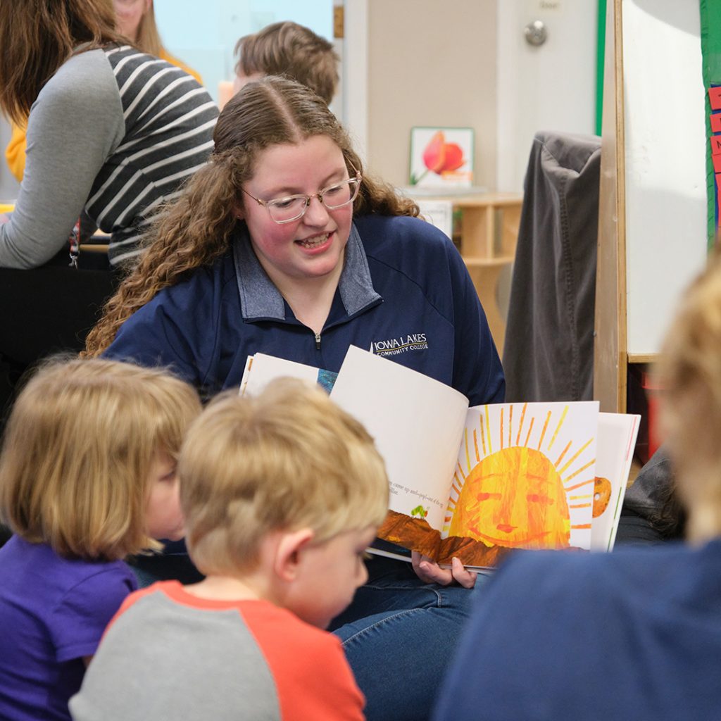 Early Childhood Education Students reads to the class.