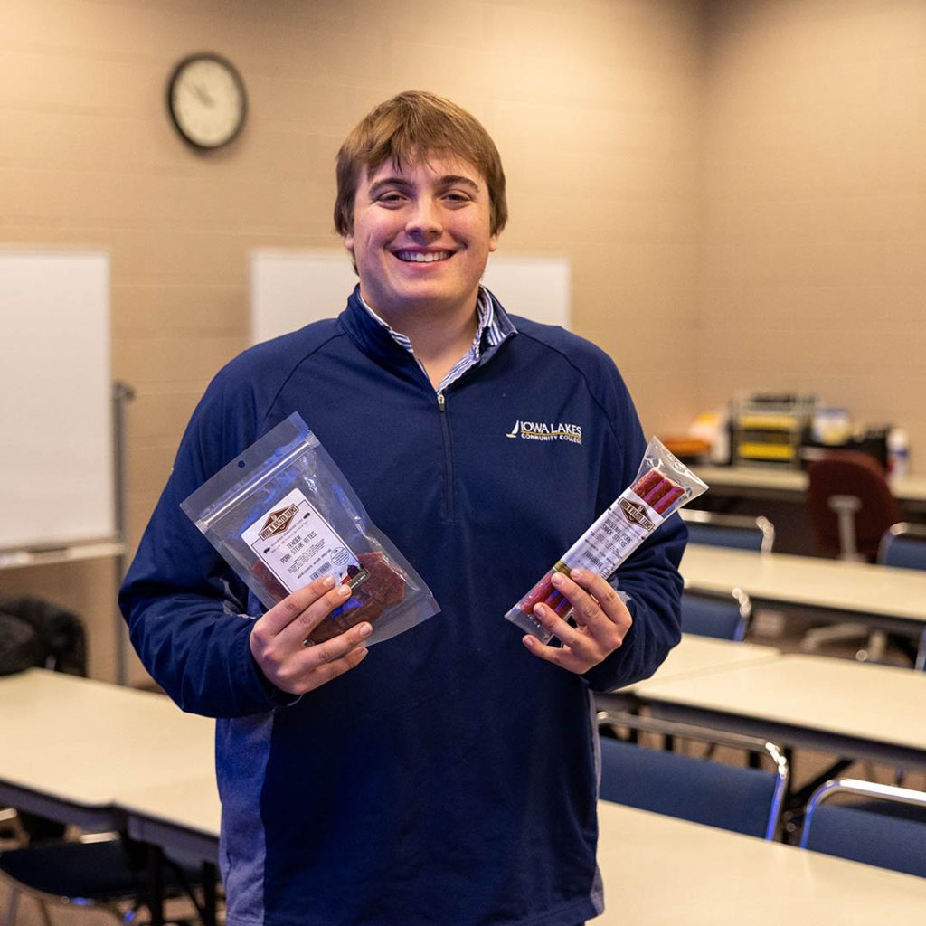 Kadin Walter poses with his line of snack meats.