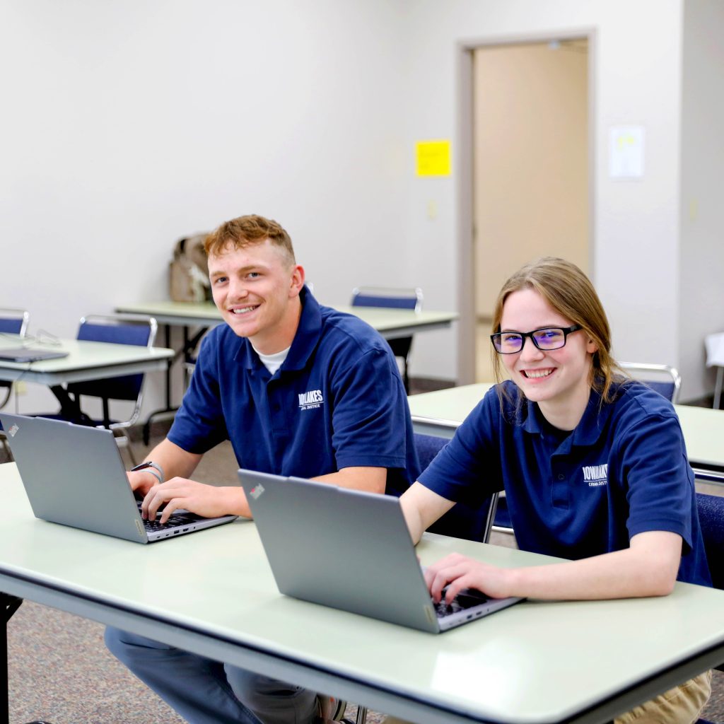 Two Iowa Lakes Students at their computers.