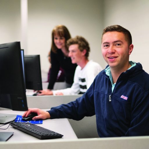 Accounting Specialist student at computer