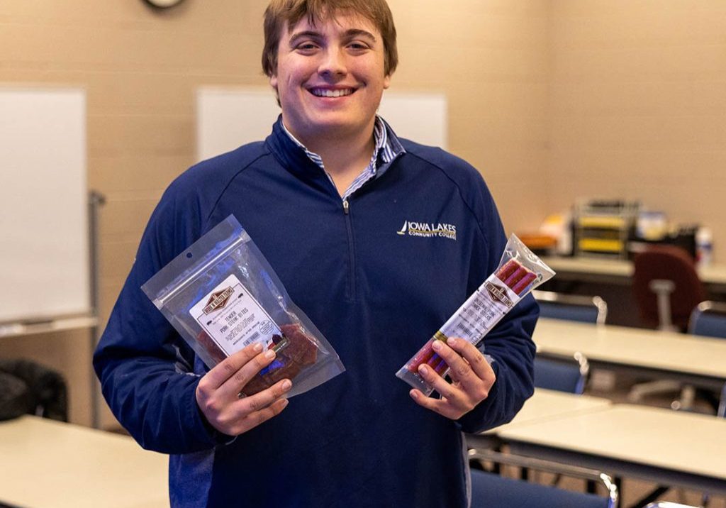 Kadin Walter poses with his line of snack meats.