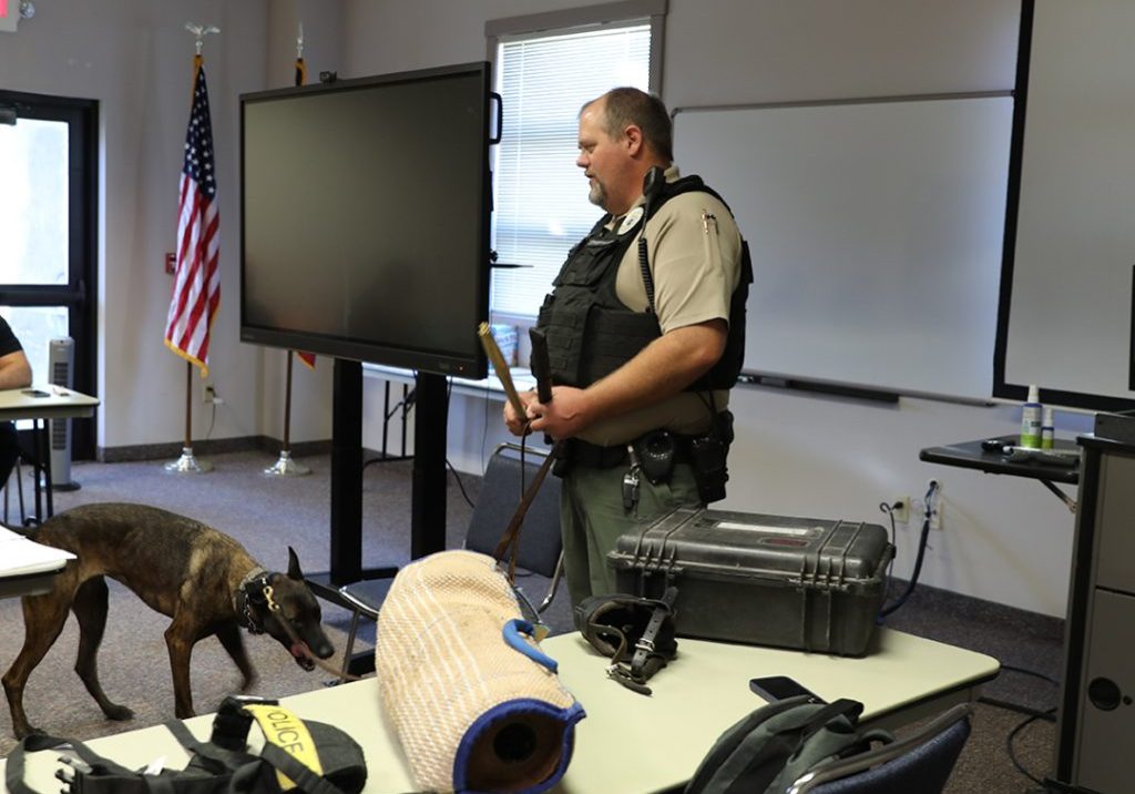 K9 Officer speaking to a classroom