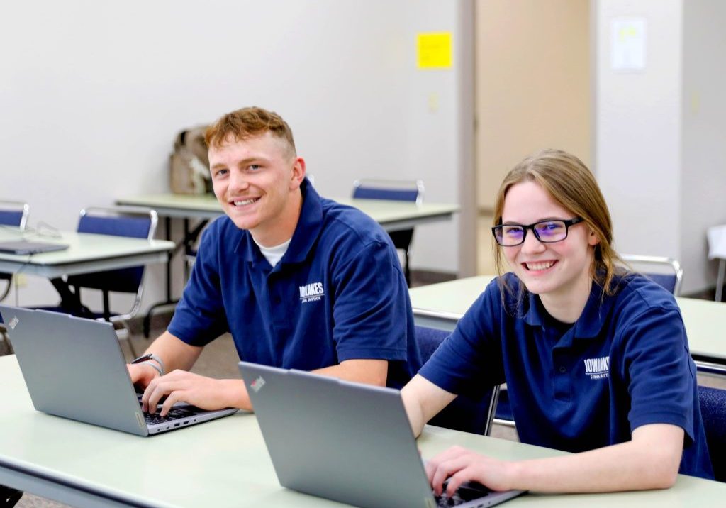 Two Iowa Lakes Students at their computers.